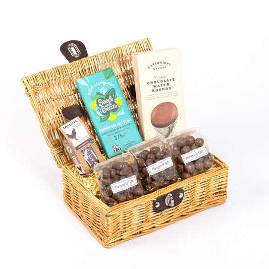 Little Cosy Night In Hamper filled with 6 chocolate, biscuit & tea items.