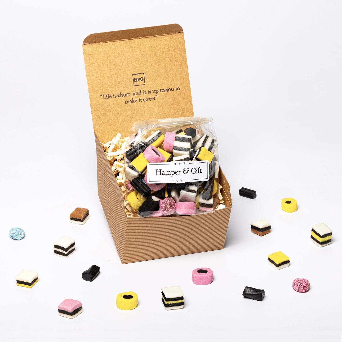Liquorice allsorts inside a recyled kraft gift box