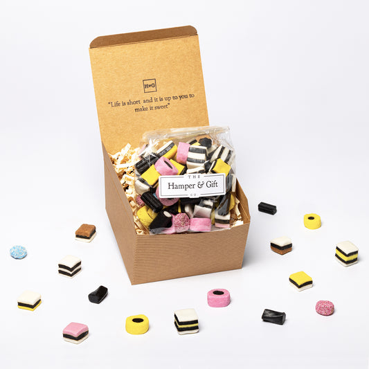 Liquorice allsorts inside a recyled kraft gift box