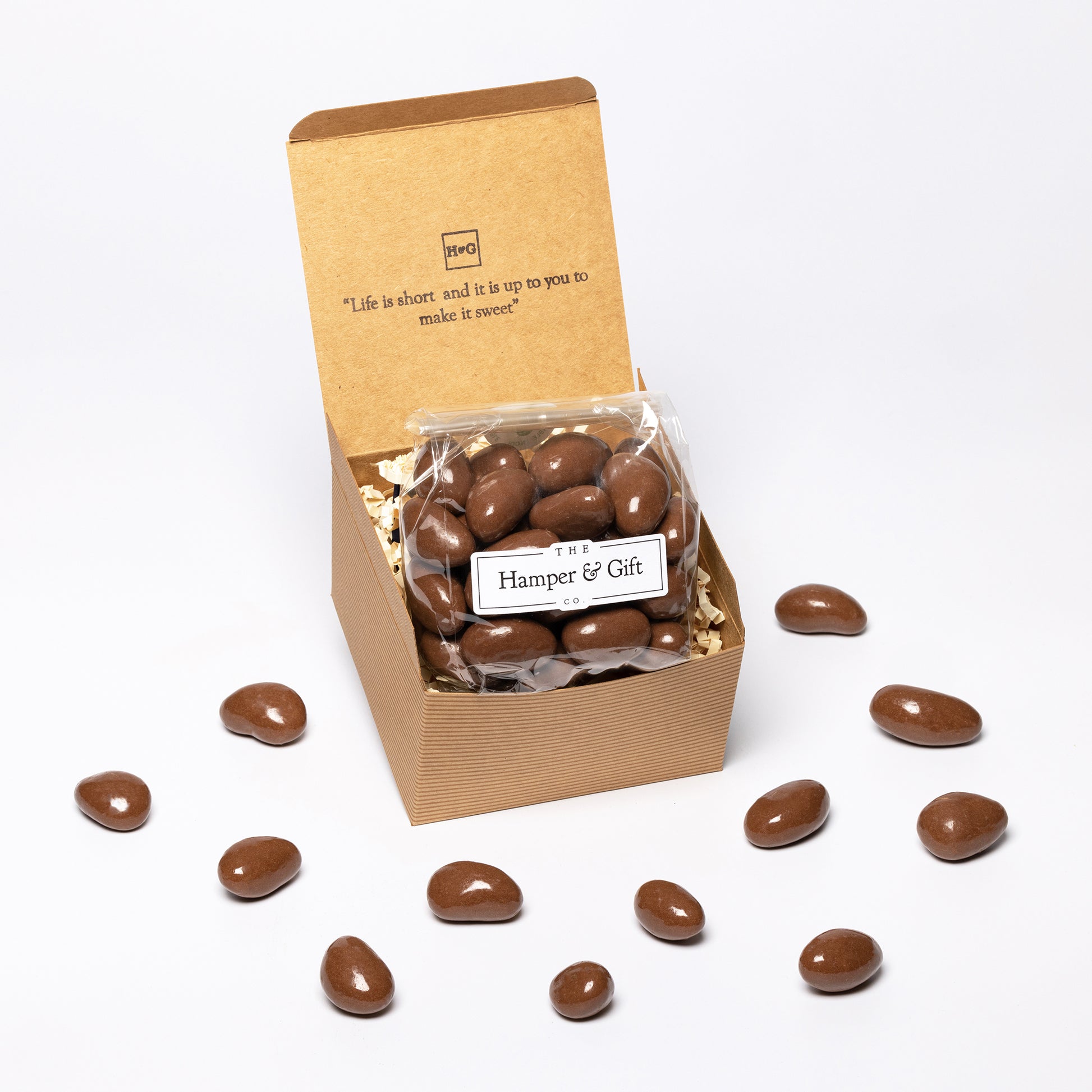 Chocolate covered Brazil Nuts inside a recyled kraft gift box