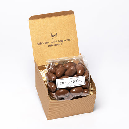 Chocolate covered Brazil Nuts inside a recyled kraft gift box